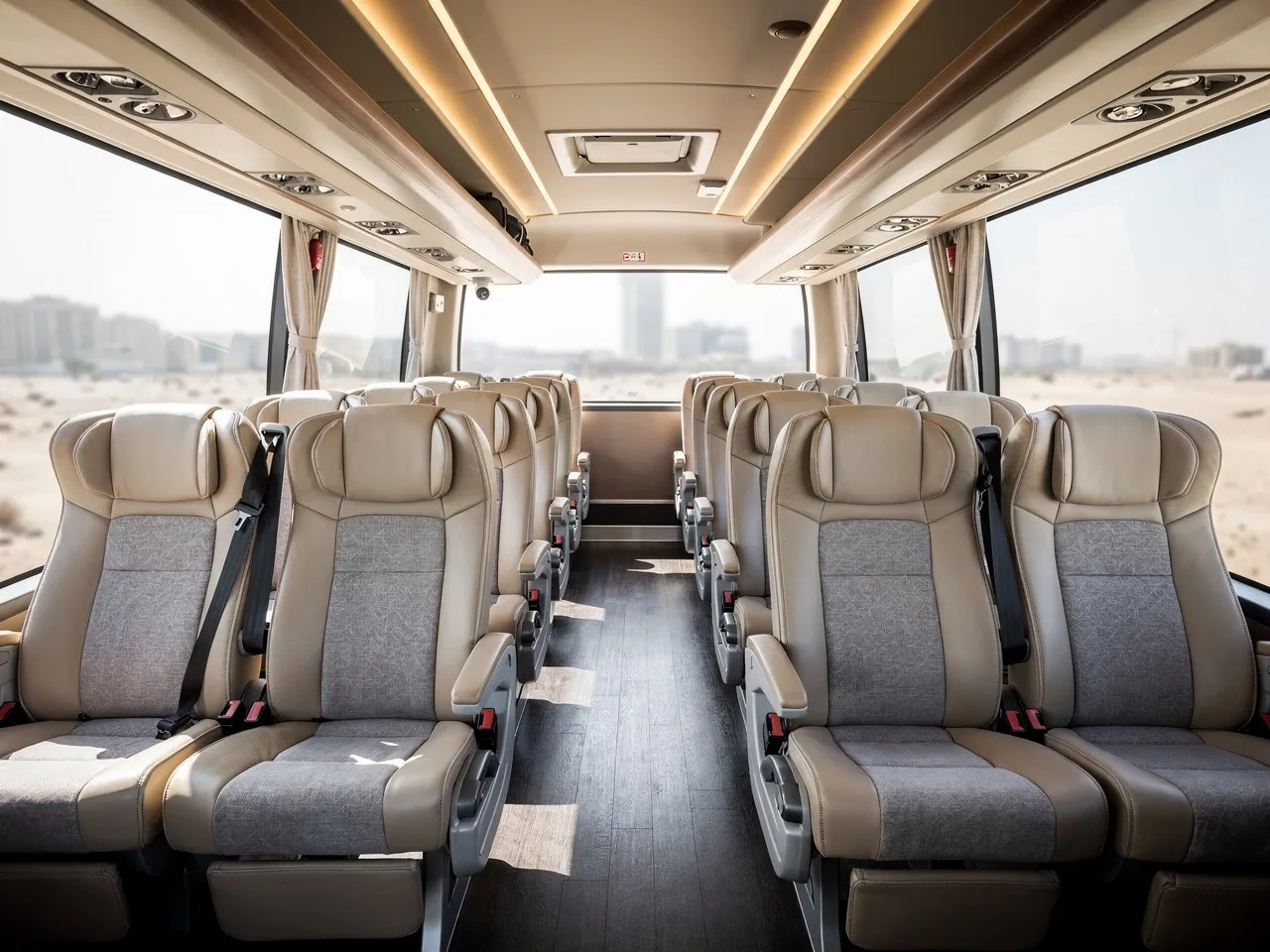 Comfortable interior of a rental bus in Qatar.